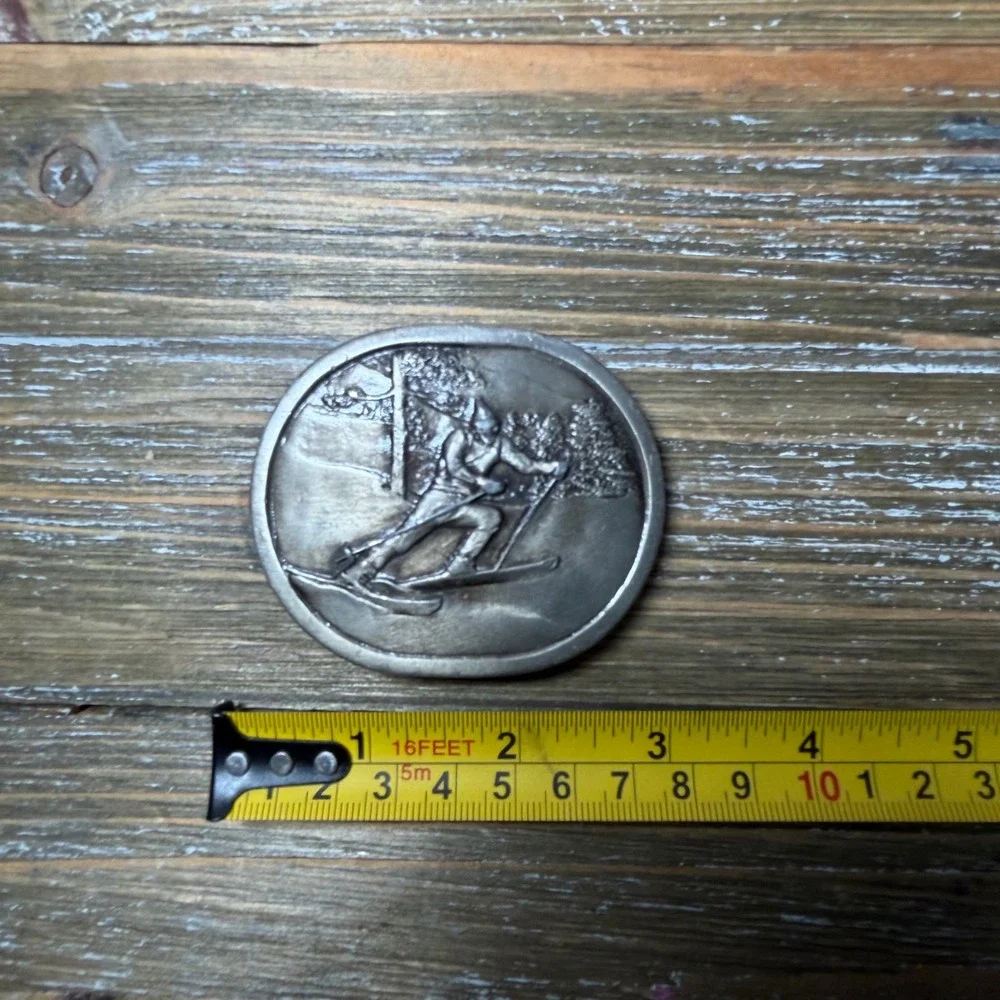 Vintage 1977 Indiana Metal Craft Alpine Skier Belt Buckle Silver Tone Oval 70s
